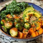 A colorful quinoa and veggie power bowl featuring Brussels sprouts, butternut squash, and kale.