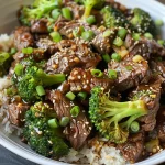 Close-up view of Beef and Broccoli stir-fry with vibrant green broccoli and tender beef slices.