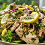Close-up view of a vibrant Lemon Chicken Salad with fresh ingredients.