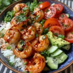 A close-up side view of a colorful Spicy Sriracha Glazed Shrimp Bowl, showcasing juicy shrimp, vibrant vegetables, and garnishes.