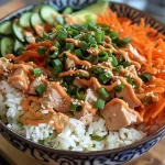 Close-up view of a Spicy Tuna Rice Bowl featuring vibrant colors and fresh ingredients.