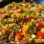 Close-up view of a Beef and Rice Skillet with colorful bell peppers.