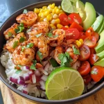 Close-up of vibrant Chili Lime Shrimp Bowl with shrimp, rice, and fresh vegetables.