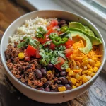 Close-up of a Ground Beef Burrito Bowl with vibrant colors from fresh ingredients.