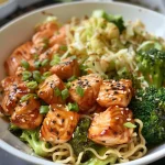 Close-up side view of a Quick Salmon Noodle Bowl with vibrant broccoli and noodles.