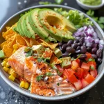 Close-up view of a Spicy Salmon Burrito Bowl featuring colorful ingredients.