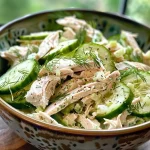 ['Close-up view of a cucumber dill turkey salad with Greek yogurt in a bowl.', 'Shredded turkey, fresh cucumbers, and dill mixed with Greek yogurt in a salad.', 'A vibrant cucumber dill turkey salad featuring chunks of cucumber and turkey.', 'Side view of a healthy salad showcasing cucumber, dill, and turkey with yogurt dressing.']