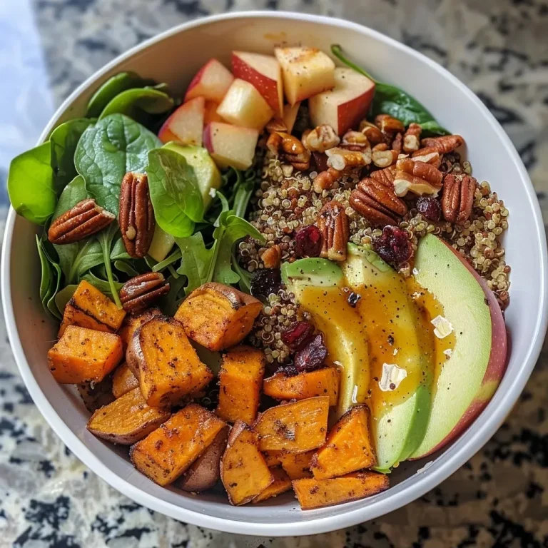 ['Close-up of a vibrant Harvest Sweet Potato Quinoa Bowl with a variety of colorful ingredients.', 'Side view of a nutritious Harvest Sweet Potato Quinoa Bowl showcasing diced sweet potatoes, quinoa, and greens.', 'Detailed view of a Harvest Sweet Potato Quinoa Bowl with sweet potatoes, baby greens, and garnishes.', 'Close-up angle of a healthy Harvest Sweet Potato Quinoa Bowl filled with colorful vegetables and nuts.']