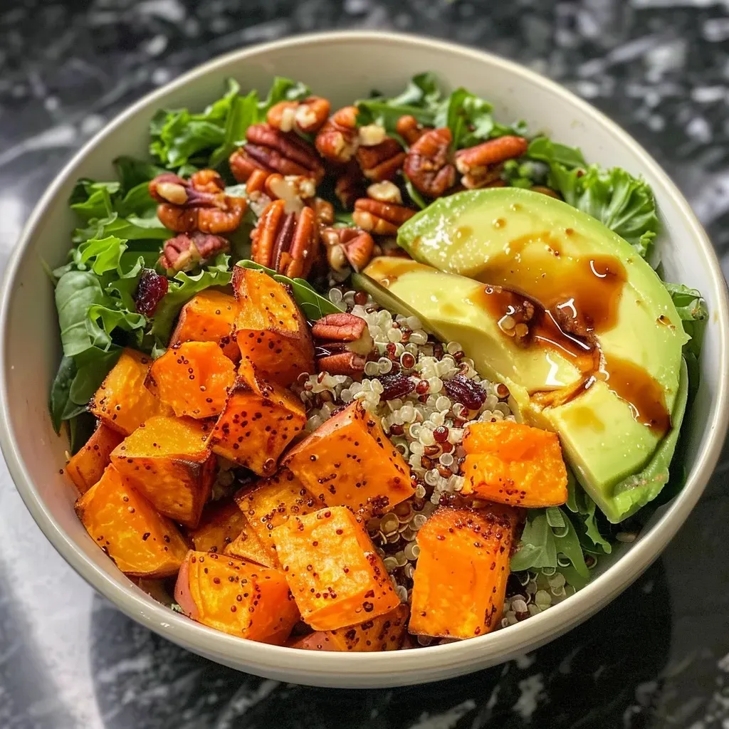 ['Close-up of a vibrant Harvest Sweet Potato Quinoa Bowl with a variety of colorful ingredients.', 'Side view of a nutritious Harvest Sweet Potato Quinoa Bowl showcasing diced sweet potatoes, quinoa, and greens.', 'Detailed view of a Harvest Sweet Potato Quinoa Bowl with sweet potatoes, baby greens, and garnishes.', 'Close-up angle of a healthy Harvest Sweet Potato Quinoa Bowl filled with colorful vegetables and nuts.']