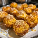 ['Close-up view of golden-brown Low-Carb Pumpkin Pretzel Bites with a fluffy texture.', 'Juicy Low-Carb Pumpkin Pretzel Bites displayed on a wooden table, showing their coating.', 'Side view of freshly baked Low-Carb Pumpkin Pretzel Bites, highlighting their soft interior.', 'Mouth-watering Low-Carb Pumpkin Pretzel Bites topped with pumpkin spice sugar.']