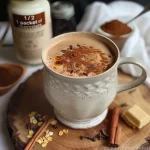 ['A close-up side view of a rich, frothy Protein Hot Chocolate Chai Latte in a glass mug.', 'Creamy Protein Hot Chocolate Chai Latte topped with a sprinkle of cinnamon, photographed from the side.', 'Side angle of a steaming Protein Hot Chocolate Chai Latte, showcasing its texture and color.', 'Glass of Protein Hot Chocolate Chai Latte with a hint of cinnamon, captured in natural light.']