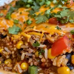 ['Close-up view of a Mexican Rice Casserole with layers of meat, rice, and cheese.', 'Side view of a delicious Mexican Rice Casserole, showcasing colorful ingredients and melted cheese.', 'Juicy Mexican Rice Casserole with ground beef and bell peppers, captured in detail.', 'A vibrant slice of Mexican Rice Casserole displaying black beans and corn on a plate.']
