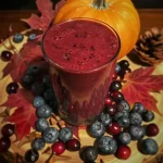 ['Close-up view of a vibrant purple smoothie in a glass, garnished with mint leaves.', 'A side view of a rich, thick purple smoothie topped with a sprinkle of cinnamon.', 'Smoothie in a clear glass showcasing deep blue and purple hues, with fruit residue on the side.', "Side angle of a Witch's Brew Smoothie, highlighting its creamy texture and fresh ingredients."]